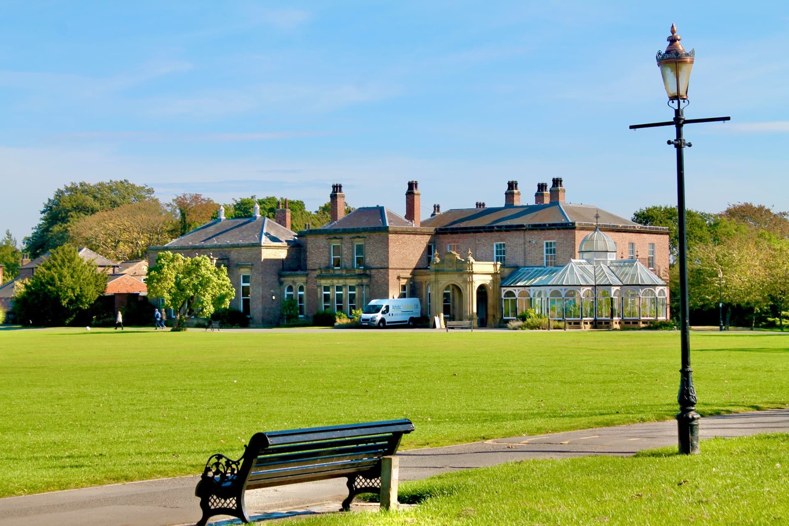 Preston Hall and its conservatory viewed across the green grounds of Preston Park Museum near Yarm